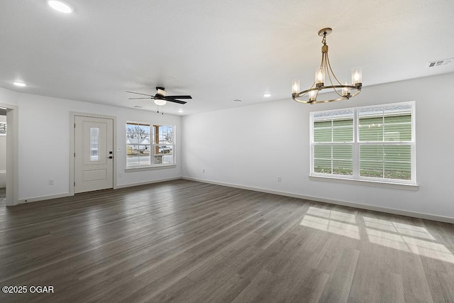 unfurnished living room with wood finished floors, visible vents, baseboards, recessed lighting, and ceiling fan with notable chandelier