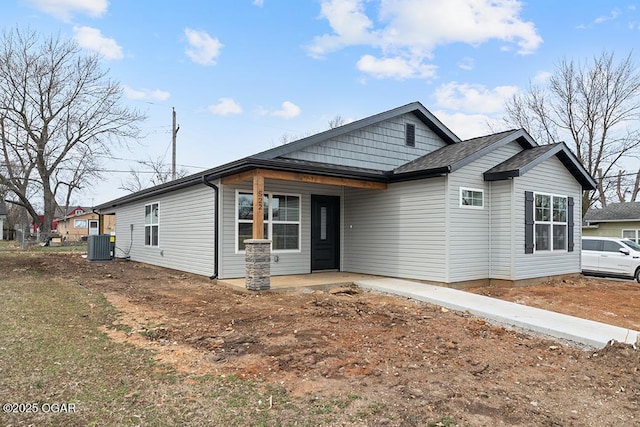 ranch-style house featuring cooling unit and a patio