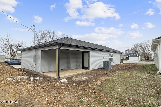 rear view of property featuring cooling unit and a patio area