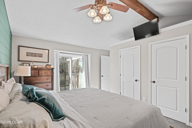 carpeted bedroom featuring lofted ceiling with beams, access to outside, and ceiling fan