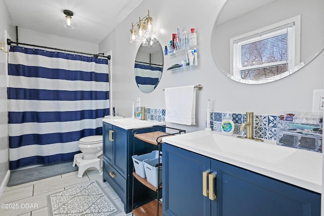 full bathroom featuring tile patterned flooring, toilet, curtained shower, and vanity