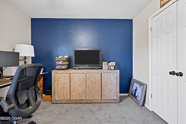 office area with baseboards and carpet floors