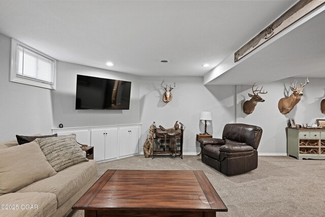 living area featuring recessed lighting, baseboards, and light colored carpet