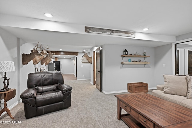 carpeted living room with recessed lighting and baseboards