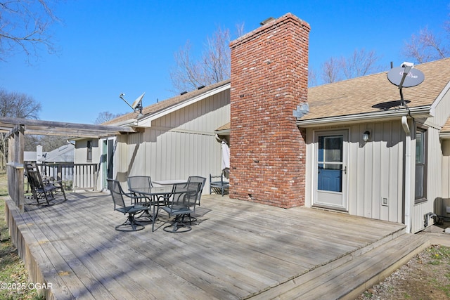 deck featuring outdoor dining area