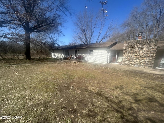 view of property exterior with a chimney