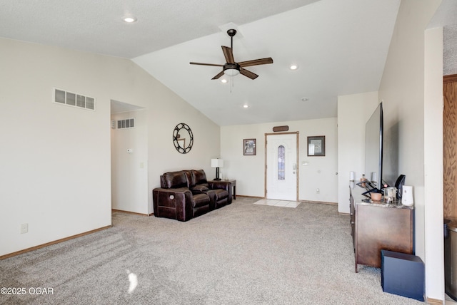 living area featuring visible vents, carpet floors, and ceiling fan