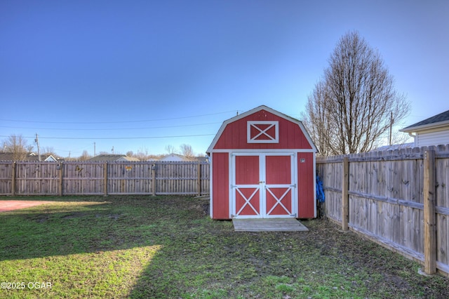 view of shed with a fenced backyard