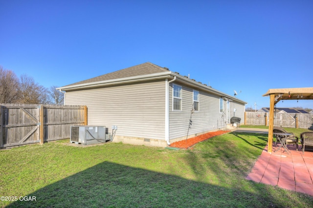 view of home's exterior featuring a patio area, central AC unit, a lawn, a fenced backyard, and crawl space