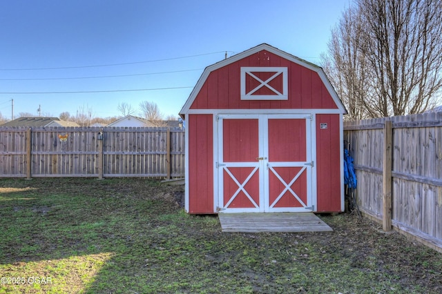 view of shed featuring a fenced backyard