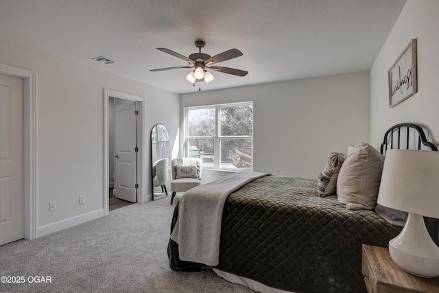 carpeted bedroom with a ceiling fan, visible vents, and baseboards