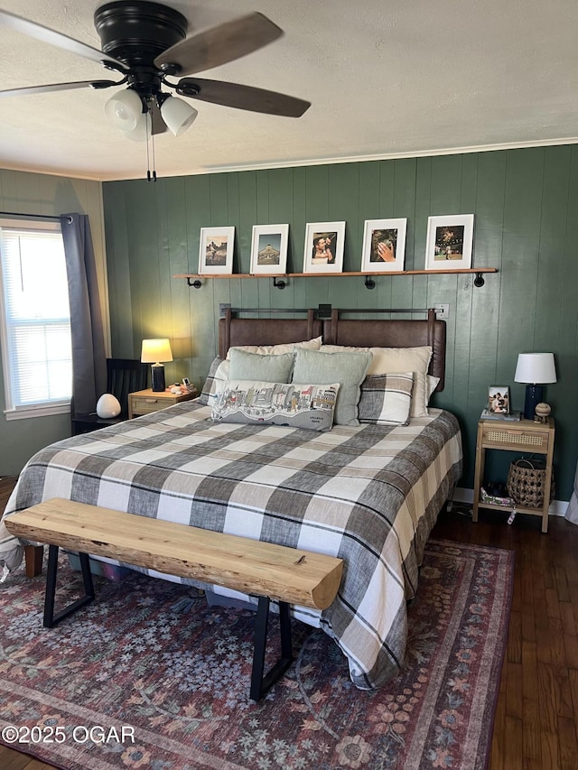 bedroom featuring a ceiling fan and hardwood / wood-style floors
