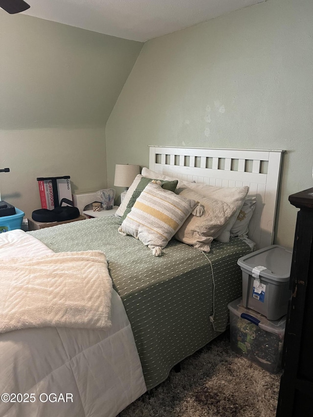 bedroom featuring lofted ceiling