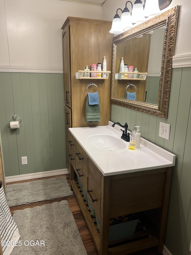 bathroom featuring wood finished floors and vanity