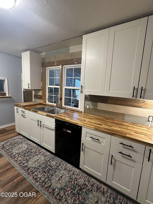 kitchen with wood counters, dark wood-style flooring, and dishwasher