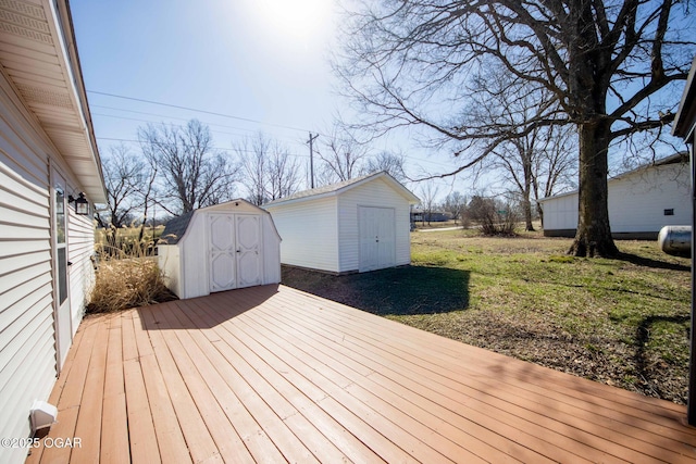 wooden terrace with an outbuilding and a shed