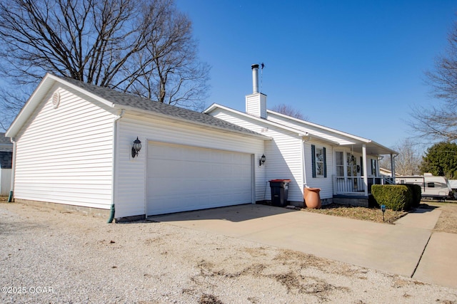 view of front of house with a porch, a garage, driveway, and a chimney