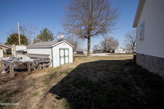 view of yard with an outbuilding and a storage unit