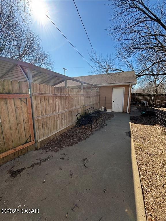 garage with fence