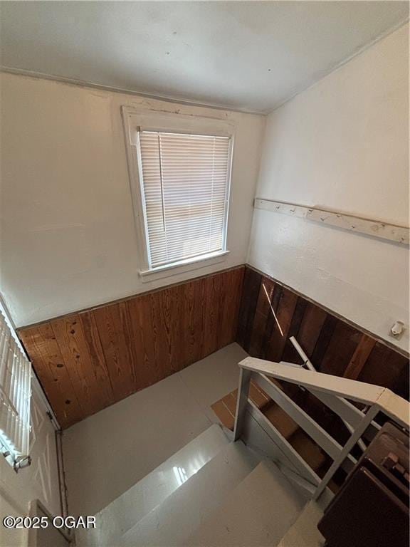 interior space with wooden walls and wainscoting