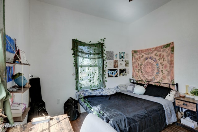 bedroom with wood finished floors