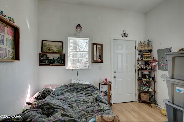 bedroom with wood finished floors