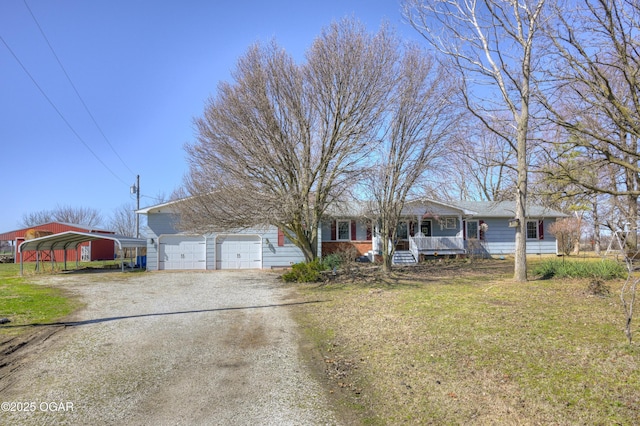 single story home with a garage, a front yard, covered porch, and dirt driveway