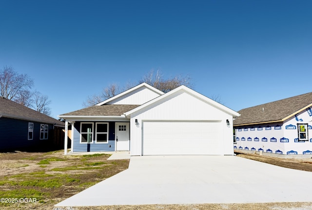 ranch-style house featuring a garage, driveway, and a shingled roof