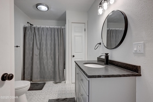 bathroom featuring curtained shower, toilet, and vanity