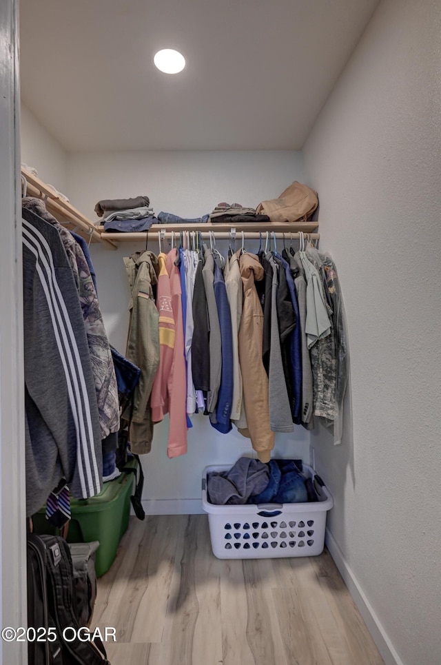 spacious closet with wood finished floors