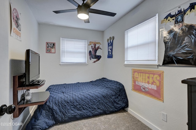 bedroom with carpet flooring, a ceiling fan, and baseboards