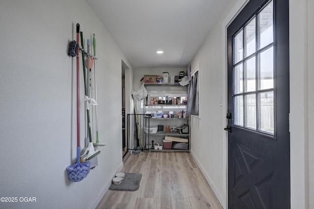 interior space with wood finished floors and baseboards