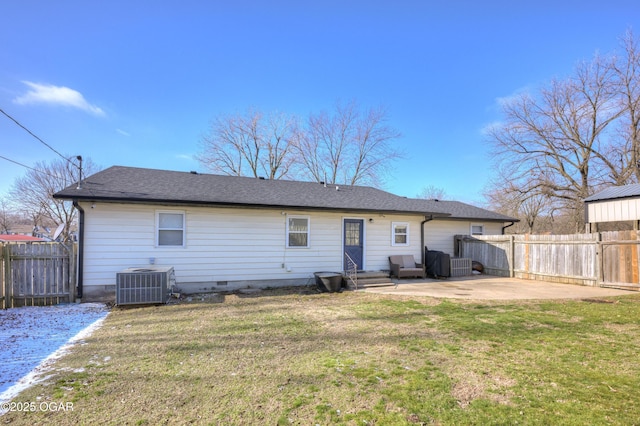 back of house with a patio, cooling unit, a lawn, and fence