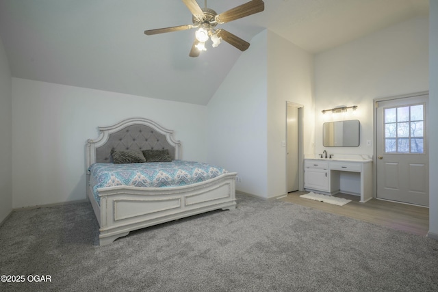 bedroom with light colored carpet, high vaulted ceiling, and ceiling fan