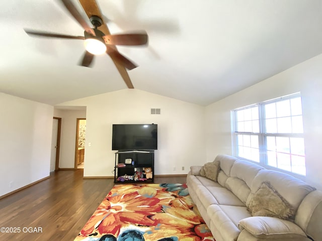 living room featuring visible vents, wood finished floors, baseboards, ceiling fan, and vaulted ceiling