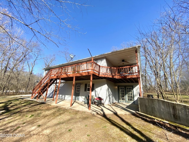 back of house featuring a ceiling fan, stairway, a patio area, and a wooden deck