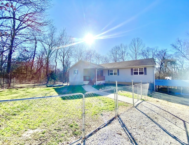 single story home with a front lawn, a gate, and a fenced front yard