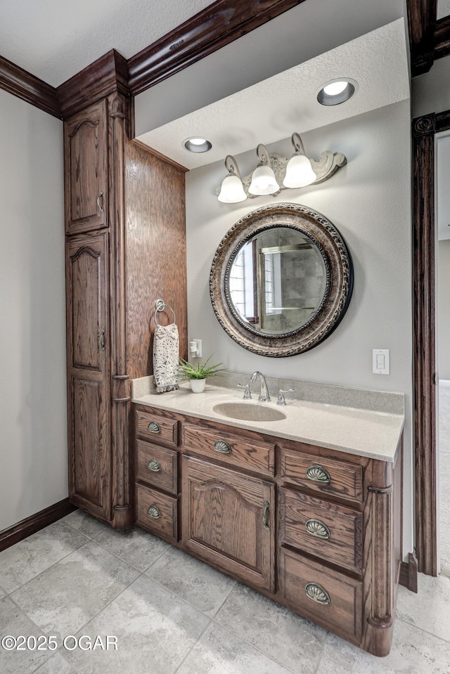 bathroom with vanity and baseboards