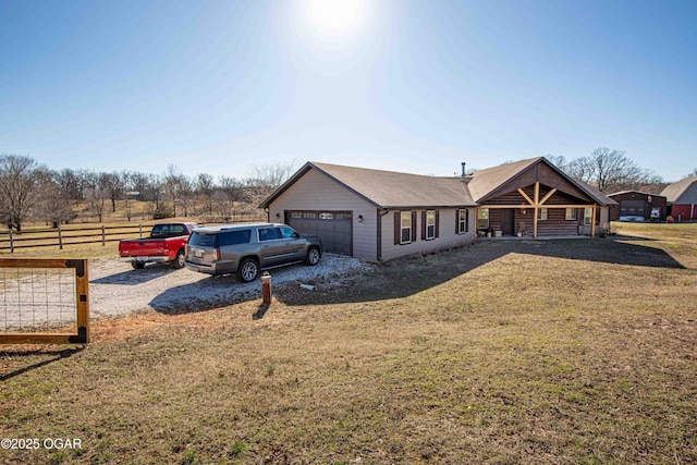 view of front of home with a front yard and fence