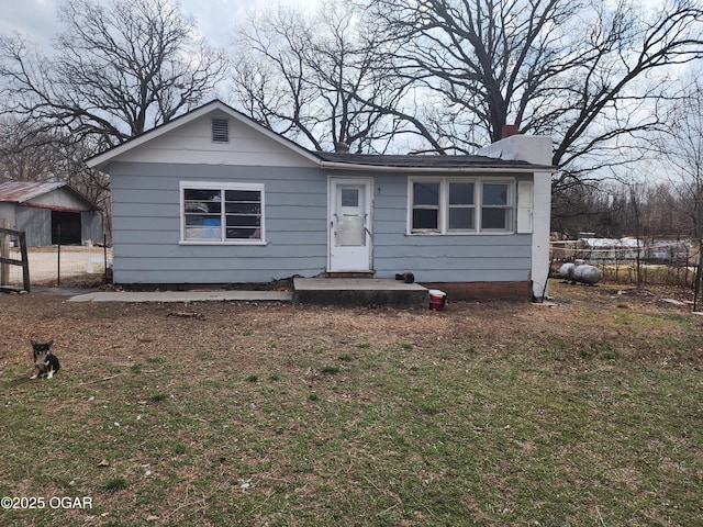 view of front of property with fence and a chimney