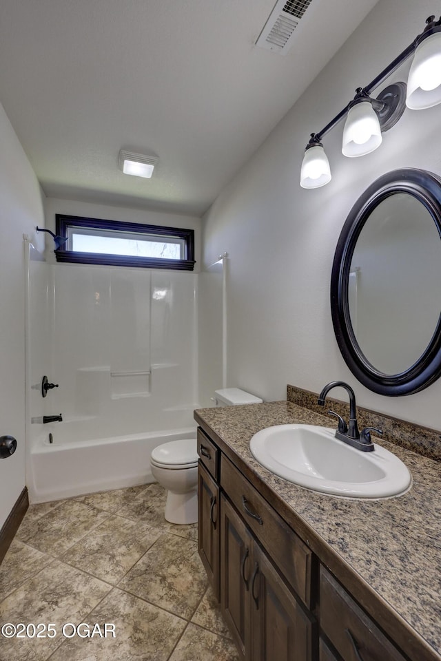 bathroom featuring vanity, bathing tub / shower combination, toilet, and visible vents