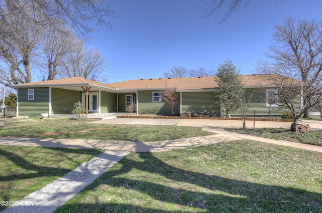 ranch-style home with covered porch and a front lawn