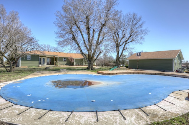 view of swimming pool featuring a covered pool