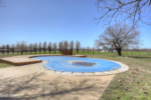 view of pool with fence