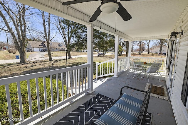 balcony featuring covered porch and ceiling fan