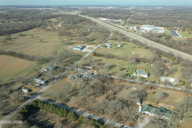 birds eye view of property with a rural view