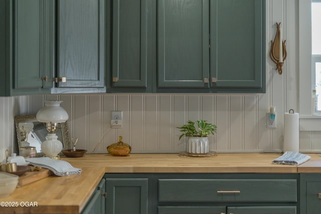 kitchen featuring green cabinets and butcher block countertops