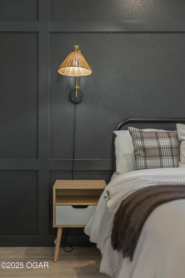 bedroom featuring wood finished floors