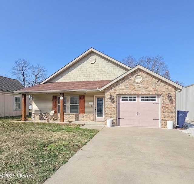 view of front of home featuring a porch, a front lawn, concrete driveway, and a garage