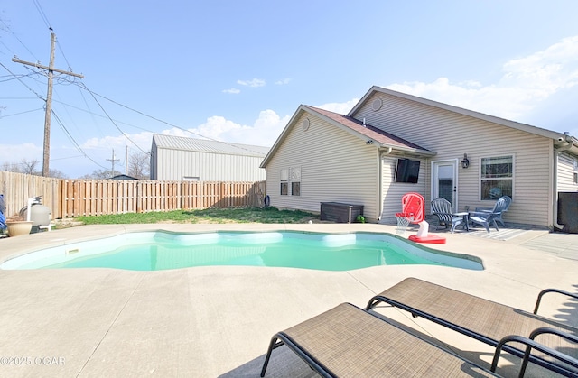 view of pool with a patio area, a fenced in pool, and a fenced backyard